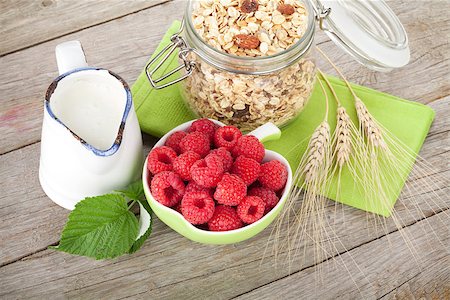 porridge and berries - Healty breakfast with muesli, berries and milk. On wooden table Stock Photo - Budget Royalty-Free & Subscription, Code: 400-07719068