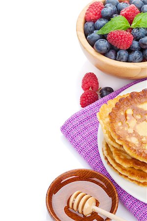 simsearch:400-09019412,k - Pancakes with raspberry, blueberry, mint and honey syrup. Isolated on white background Foto de stock - Super Valor sin royalties y Suscripción, Código: 400-07719088