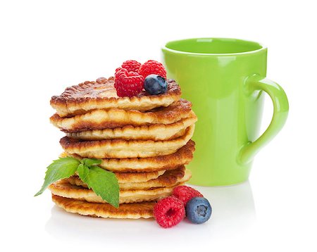 simsearch:400-09019412,k - Pancakes with raspberry, blueberry and cup of drink. Isolated on white background Foto de stock - Super Valor sin royalties y Suscripción, Código: 400-07719080
