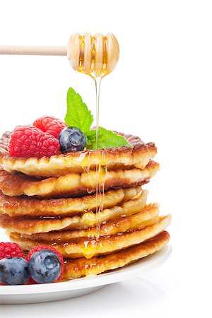 pancake bake - Pancakes with raspberry, blueberry, mint and honey syrup. Isolated on white background Stock Photo - Budget Royalty-Free & Subscription, Code: 400-07719091