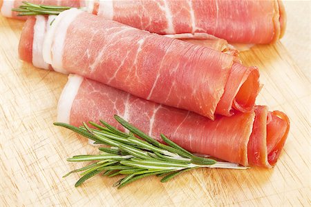simsearch:400-07481817,k - Prosciutto with herbs on cutting board Stock Photo - Budget Royalty-Free & Subscription, Code: 400-07719198