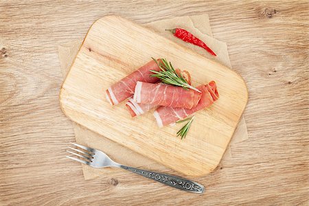 simsearch:400-07481817,k - Prosciutto with spices. Over wooden table background Stock Photo - Budget Royalty-Free & Subscription, Code: 400-07719199
