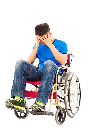 simsearch:400-07987656,k - upset handicapped man sitting on a wheelchair Stock Photo - Budget Royalty-Free & Subscription, Code: 400-07719988