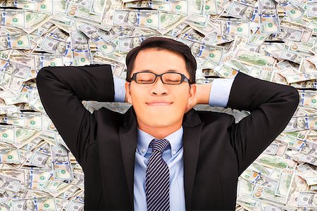 pictures of man lying on money - business man enjoying and lying on the money Stock Photo - Budget Royalty-Free & Subscription, Code: 400-07719983