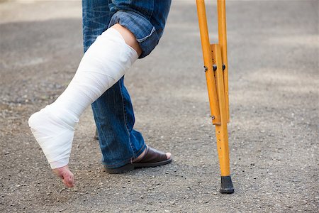 asian Young man on crutches with tree background Stock Photo - Budget Royalty-Free & Subscription, Code: 400-07719995