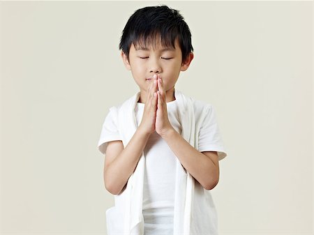 six year old little asian boy praying. Stock Photo - Budget Royalty-Free & Subscription, Code: 400-07712867
