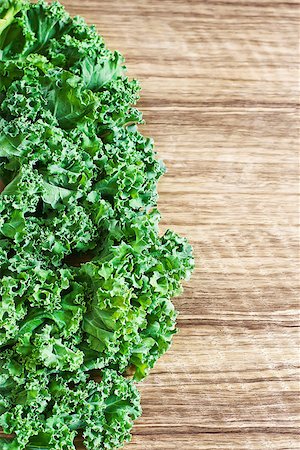 Fresh green kale on wood table. Copy space background. Stock Photo - Budget Royalty-Free & Subscription, Code: 400-07713415