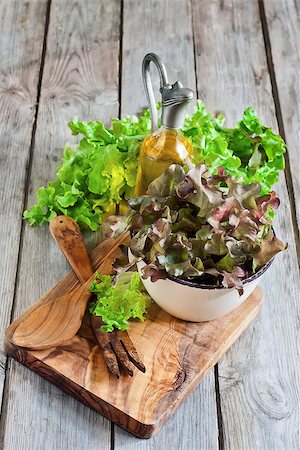 simsearch:400-06485512,k - Green salad lettuce with olive oil on old wooden table. Selective focus. Stock Photo - Budget Royalty-Free & Subscription, Code: 400-07713454