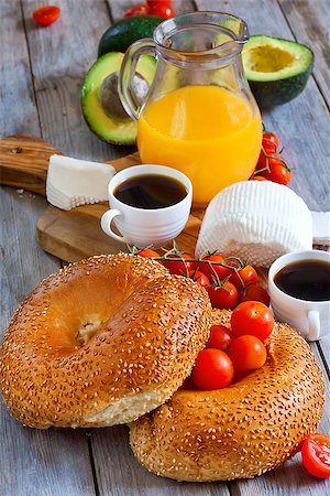 simsearch:400-04416282,k - Beygale, tzfat cheese, ripe avocado, cherry tomato, coffee and fresh orange juice - traditional israelian breakfast. Selective focus. Stock Photo - Budget Royalty-Free & Subscription, Code: 400-07713450