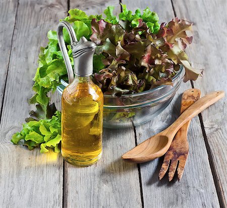 simsearch:400-06485512,k - Green salad lettuce with olive oil on old wooden table. Selective focus. Stock Photo - Budget Royalty-Free & Subscription, Code: 400-07713452