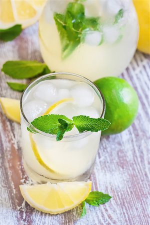 fresh glass of ice water - Mint lemonad in glasses and pitcher. Selective focus. Stock Photo - Budget Royalty-Free & Subscription, Code: 400-07713465