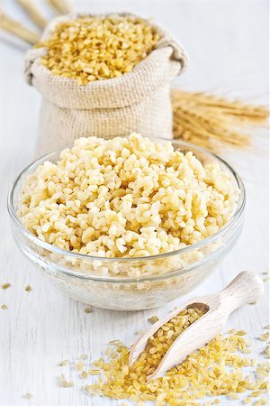 simsearch:400-07993665,k - Raw cracked durum wheat or bulgur in bag. Popular ingredient in Middle Eastern cuisine. Fotografie stock - Microstock e Abbonamento, Codice: 400-07713478