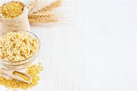 simsearch:400-07993665,k - Raw cracked durum wheat or bulgur in bag. Popular ingredient in Middle Eastern cuisine. Fotografie stock - Microstock e Abbonamento, Codice: 400-07713479