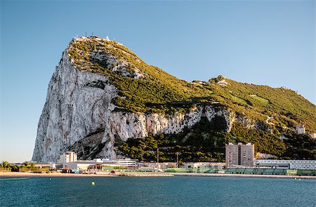 Day view of Gibraltar. Gibraltar is a British Overseas Territory located on the southern end of the Iberian Peninsula at the entrance of the Mediterranean Sea Fotografie stock - Microstock e Abbonamento, Codice: 400-07713618