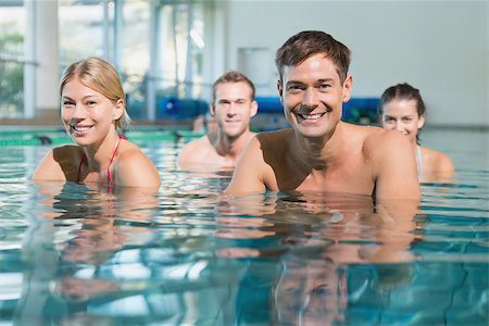 simsearch:400-07724714,k - Fitness class using underwater exercise bikes in swimming pool at the leisure centre Stock Photo - Budget Royalty-Free & Subscription, Code: 400-07724686