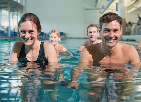 simsearch:400-07724714,k - Fitness class using underwater exercise bikes in swimming pool at the leisure centre Stock Photo - Budget Royalty-Free & Subscription, Code: 400-07724683
