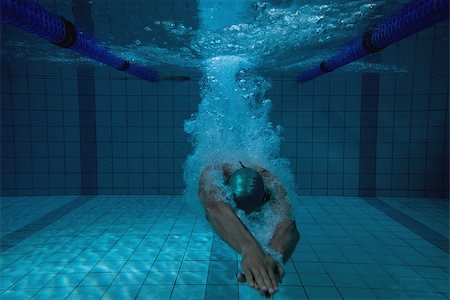 simsearch:614-06043548,k - Fit swimmer training on his own in the swimming pool at the leisure centre Photographie de stock - Aubaine LD & Abonnement, Code: 400-07724860