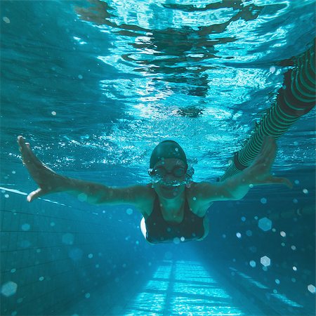 simsearch:400-07583085,k - Athletic swimmer swimming towards camera in the swimming pool at the leisure centre Stock Photo - Budget Royalty-Free & Subscription, Code: 400-07724889