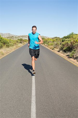 simsearch:400-07936740,k - Fit man jogging on the open road on a sunny day Foto de stock - Super Valor sin royalties y Suscripción, Código: 400-07724967