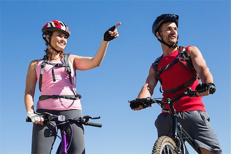 pictures of the cyclist track - Fit cyclist couple standing at the summit on a sunny day Stock Photo - Budget Royalty-Free & Subscription, Code: 400-07725204