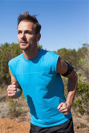 simsearch:400-07936740,k - Athletic man jogging up country trail on a sunny day Foto de stock - Super Valor sin royalties y Suscripción, Código: 400-07725263