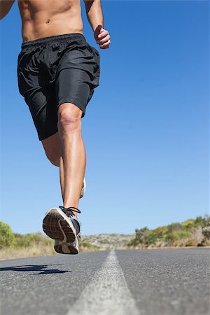 simsearch:400-07936740,k - Shirtless man jogging on open road on a sunny day Foto de stock - Super Valor sin royalties y Suscripción, Código: 400-07725282