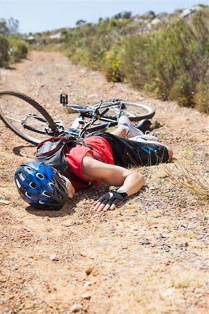 pictures of the cyclist track - Injured cyclist lying on ground after a crash on a sunny day Stock Photo - Budget Royalty-Free & Subscription, Code: 400-07725317