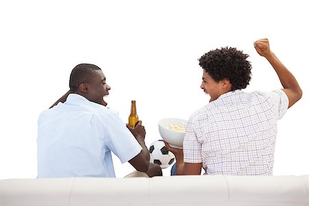 sports spectator sofa - Cheering sports fans sitting on the couch with beers on white background Stock Photo - Budget Royalty-Free & Subscription, Code: 400-07725437