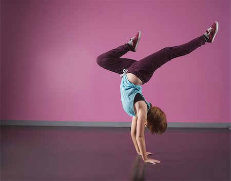 simsearch:400-06140923,k - Pretty break dancer doing a handstand in the dance studio Stock Photo - Budget Royalty-Free & Subscription, Code: 400-07725605