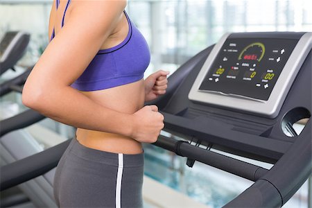 simsearch:400-07688341,k - Fit woman running on the treadmill at the gym Stock Photo - Budget Royalty-Free & Subscription, Code: 400-07725755