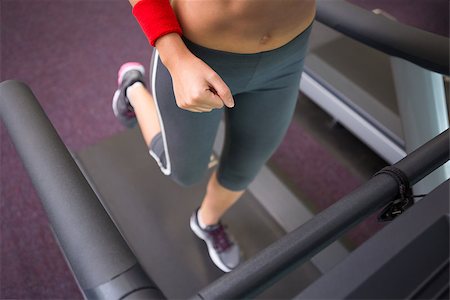 simsearch:400-07688341,k - Fit woman running on the treadmill at the gym Stock Photo - Budget Royalty-Free & Subscription, Code: 400-07725764