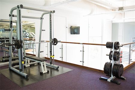 Empty weights room with bench press at the leisure center Stock Photo - Budget Royalty-Free & Subscription, Code: 400-07725828