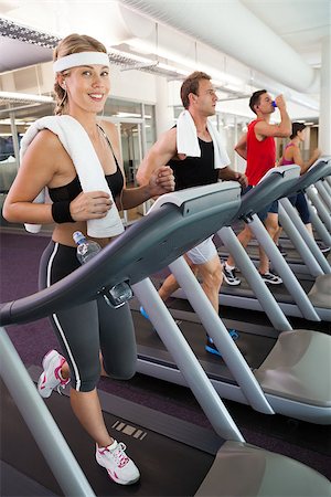 simsearch:400-07725772,k - Row of people working out on treadmills at the gym Photographie de stock - Aubaine LD & Abonnement, Code: 400-07725935