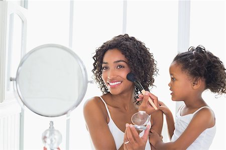 Pretty mother teaching her daughter about makeup at home in the bathroom Stock Photo - Budget Royalty-Free & Subscription, Code: 400-07726273