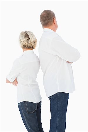 simsearch:400-07726578,k - Upset couple not talking to each other after fight on white background Fotografie stock - Microstock e Abbonamento, Codice: 400-07726407