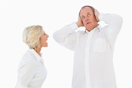 simsearch:400-07726420,k - Angry older couple arguing with each other on white background Fotografie stock - Microstock e Abbonamento, Codice: 400-07726401