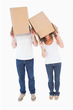 Mature couple wearing boxes over their heads on white background Stock Photo - Budget Royalty-Free & Subscription, Code: 400-07726423