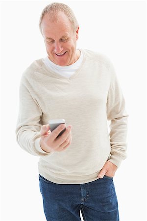 Happy mature man sending a text on white background Stock Photo - Budget Royalty-Free & Subscription, Code: 400-07726505