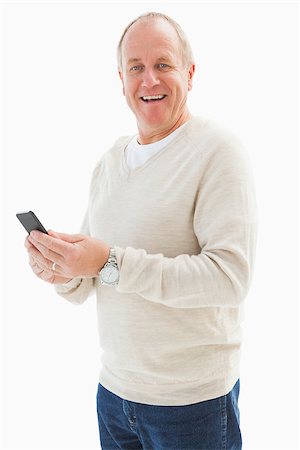 Happy mature man sending a text on white background Stock Photo - Budget Royalty-Free & Subscription, Code: 400-07726503