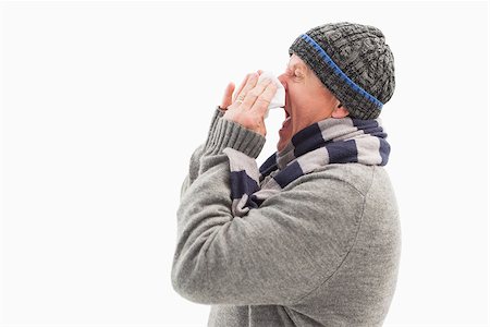 simsearch:400-06888942,k - Sick mature man blowing his nose on white background Photographie de stock - Aubaine LD & Abonnement, Code: 400-07726594