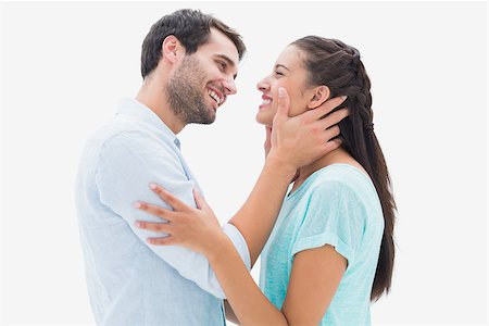 Attractive young couple about to kiss on white background Stock Photo - Budget Royalty-Free & Subscription, Code: 400-07726628