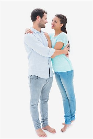 Attractive young couple hugging each other on white background Stock Photo - Budget Royalty-Free & Subscription, Code: 400-07726629