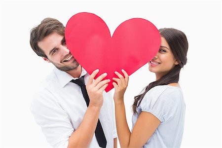 simsearch:400-07686534,k - Couple smiling at camera holding a heart on white background Foto de stock - Royalty-Free Super Valor e Assinatura, Número: 400-07726704