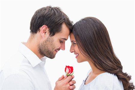 simsearch:400-07726699,k - Handsome man offering his girlfriend a rose on white background Foto de stock - Super Valor sin royalties y Suscripción, Código: 400-07726708