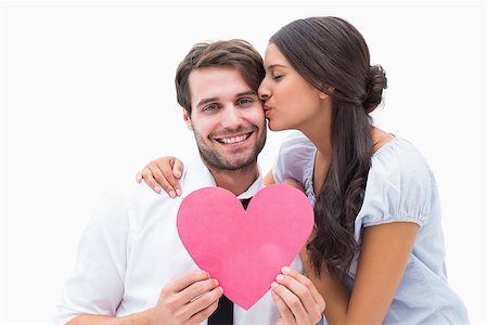 simsearch:400-07935196,k - Pretty brunette giving boyfriend a kiss and her heart on white background Foto de stock - Royalty-Free Super Valor e Assinatura, Número: 400-07726700