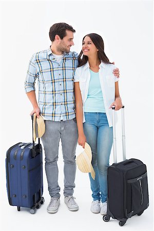 Attractive young couple going on their holidays on white background Stock Photo - Budget Royalty-Free & Subscription, Code: 400-07726774
