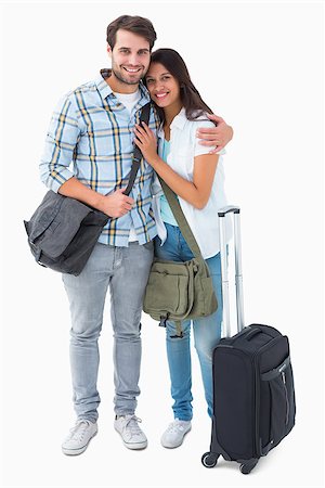 Attractive young couple going on their holidays on white background Stock Photo - Budget Royalty-Free & Subscription, Code: 400-07726775