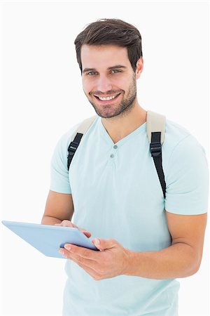 Handsome student using his tablet pc on white background Stock Photo - Budget Royalty-Free & Subscription, Code: 400-07726929