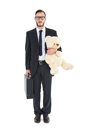 simsearch:400-08020381,k - Geeky businessman holding briefcase and teddy on white background Fotografie stock - Microstock e Abbonamento, Codice: 400-07726969