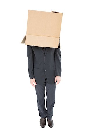 Businessman standing with box on head  on white background Stock Photo - Budget Royalty-Free & Subscription, Code: 400-07727018